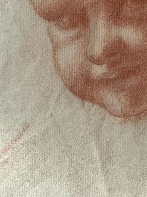 fig 4. A pair of framed antique red chalk drawings on paper depicting a childs head and a draped standing figure, set in ebonised frames with gilt inner rims.