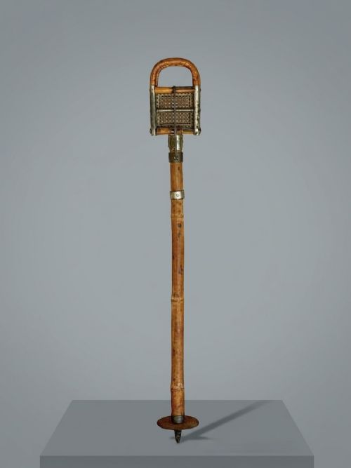 fig 1. An Edwardian bamboo shooting stick featuring folding handles with woven cane panels and metal fittings.