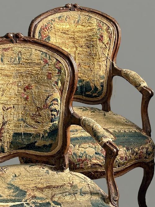 fig 2. A pair of French Louis XV style armchairs featuring carved walnut frames and original Aubusson tapestry upholstery.