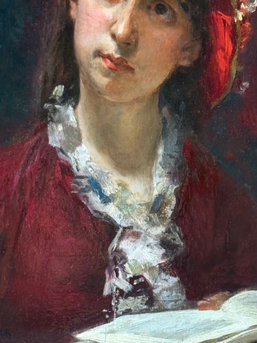 fig 2. A 19th-century oil portrait depicting a young woman wearing a crimson hat and dress while holding an open book.