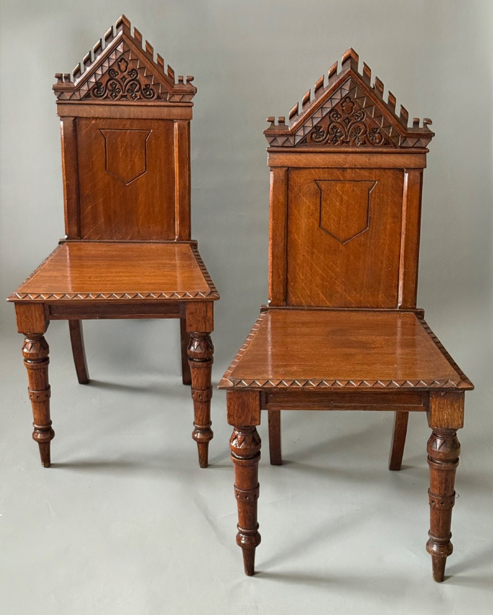 PAIR OF 19TH CENTURY GOTHIC CARVED HALL CHAIRS