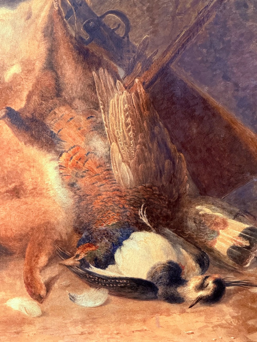 A nineteenth-century watercolour and bodycolour painting depicting a game still life with a hare, pheasant, lapwing, and a shotgun. View IV