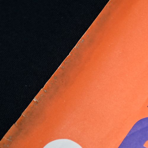 fig 1. A vintage promotional lithograph poster for Coney Beach in Porthcawl, depicting a woman riding a decorated carousel horse against a bright orange and blue background.