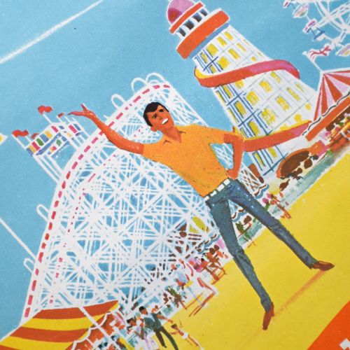 fig 4. A vintage promotional lithograph poster for Coney Beach in Porthcawl, depicting a woman riding a decorated carousel horse against a bright orange and blue background.