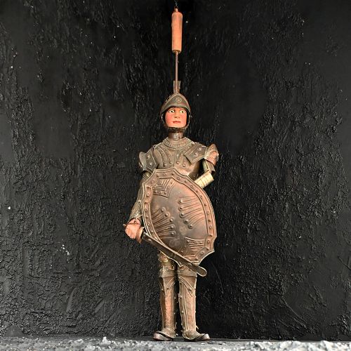 fig 1. A nineteenth-century Sicilian marionette depicting an armoured knight holding a sword and shield, crafted from carved wood and embossed metal.