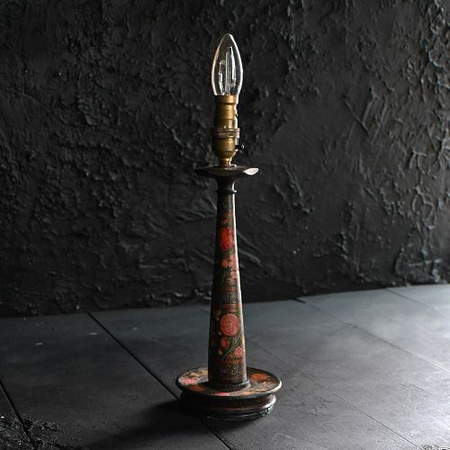 fig 1. An early 20th-century hand-painted Kashmiri table lamp base featuring dark lacquer with red and gold floral motifs and a brass fitting.
