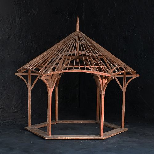 fig 1. An early twentieth-century hexagonal pine architectural model of a gazebo with exposed rafters and a central roof finial.