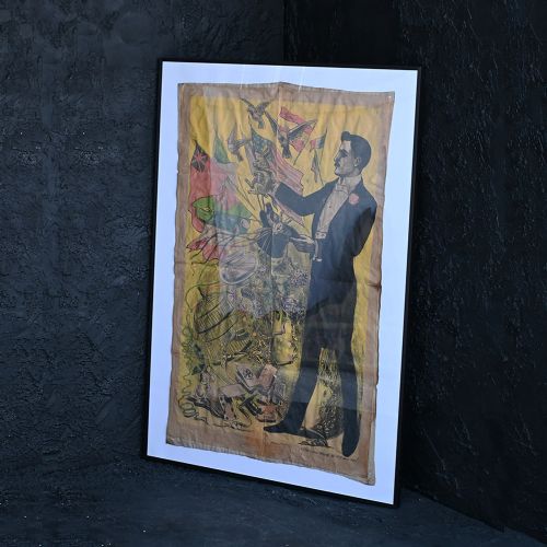 fig 1. A nineteenth-century French theatrical poster printed on canvas depicting a magician in a black tuxedo pulling a rabbit from a top hat alongside flags and stage props.