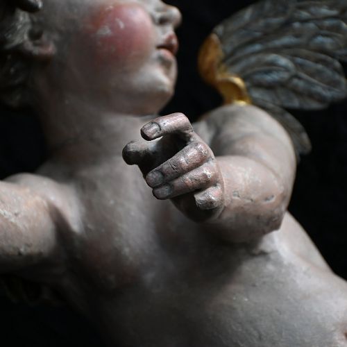 fig 2. A pair of early nineteenth-century hand-carved wooden angels featuring polychrome paint, winged backs, and draped gold leaf loincloths.