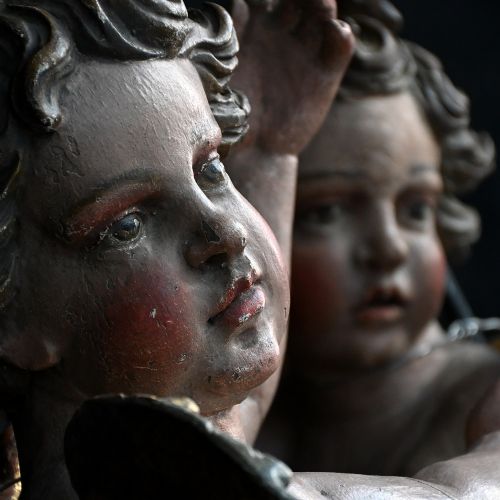 fig 4. A pair of early nineteenth-century hand-carved wooden angels featuring polychrome paint, winged backs, and draped gold leaf loincloths.