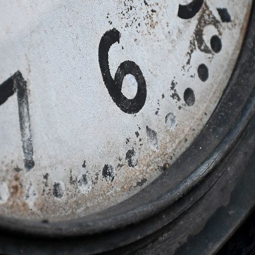 fig 4. An oversized circular French station wall clock featuring a dark grey metal bezel, off-white dial with Arabic numerals, and French maker inscriptions.