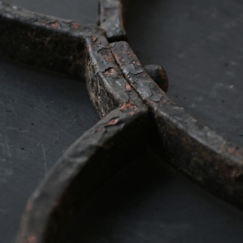fig 9. A Victorian Gothic Revival pointed archway made from dark wrought iron featuring leaf crockets and circular tracery.