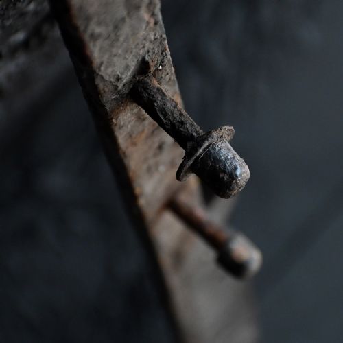 fig 11. A Victorian Gothic Revival pointed archway made from dark wrought iron featuring leaf crockets and circular tracery.