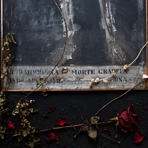 fig 3. An early nineteenth-century Italian oil painting depicting a full-length skeleton on a distressed dark background with an Italian inscription at the base.