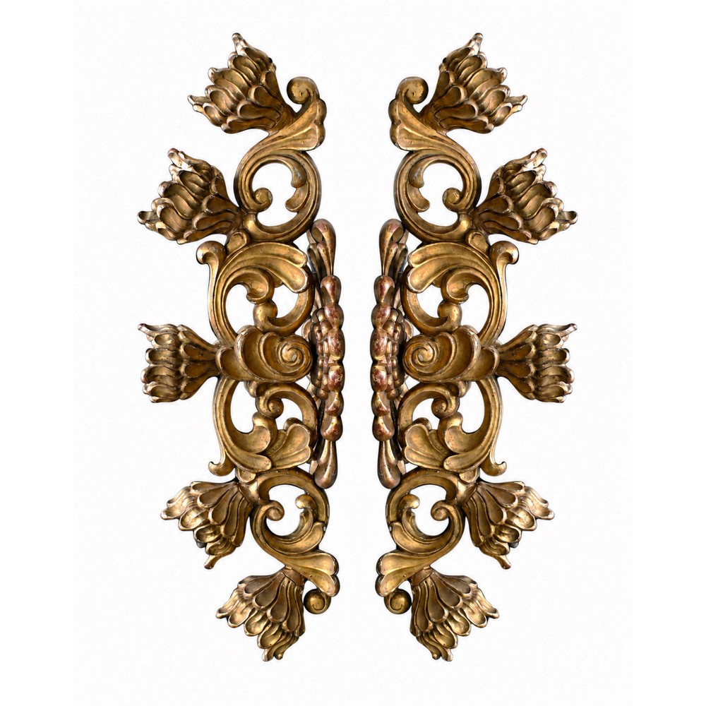 A pair of 19th-century hand-carved Italian giltwood wall light fittings featuring intricate scrolling foliage and floral motifs.
