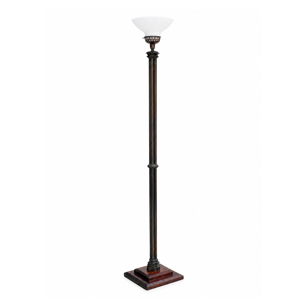 An early 20th-century English Gothic Revival floor lamp featuring a dark carved column on a stepped square base topped with a white frosted glass shade.