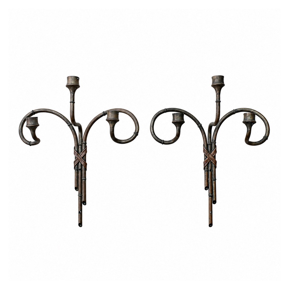 A pair of early 20th century patinated metal wall sconces formed in the shape of bamboo stalks with three sweeping curved branches holding candle sockets.