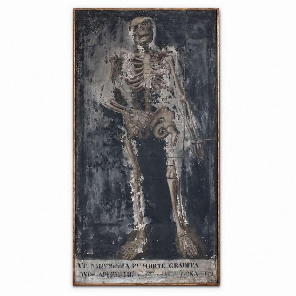An early nineteenth-century Italian oil painting depicting a full-length skeleton on a distressed dark background with an Italian inscription at the base.