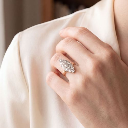 fig 3. An Edwardian navette cluster ring featuring multiple old cut diamonds set in platinum with an 18ct yellow gold band.