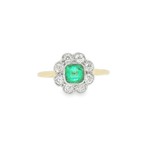 fig 1. An antique 18ct yellow gold ring featuring a central square green emerald surrounded by a scalloped cluster of diamonds.