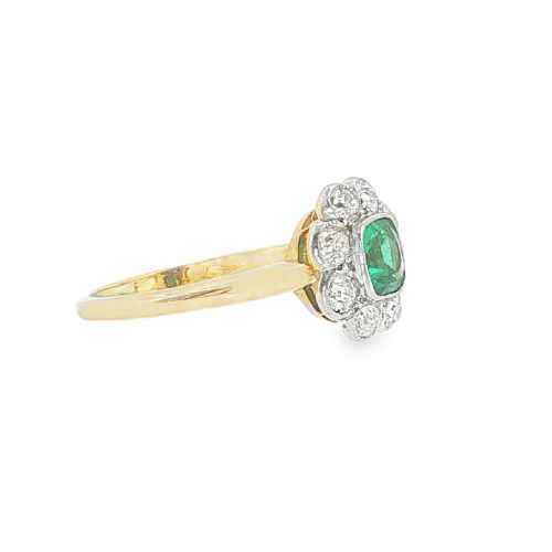 fig 2. An antique 18ct yellow gold ring featuring a central square green emerald surrounded by a scalloped cluster of diamonds.