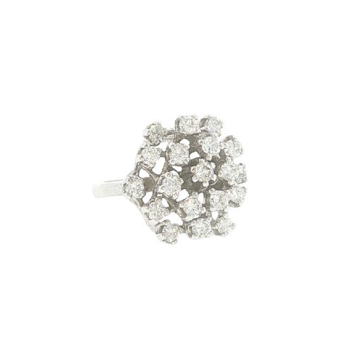 A vintage 1970s 18ct white gold cocktail ring featuring a domed cluster setting filled with round brilliant cut diamonds. View VII