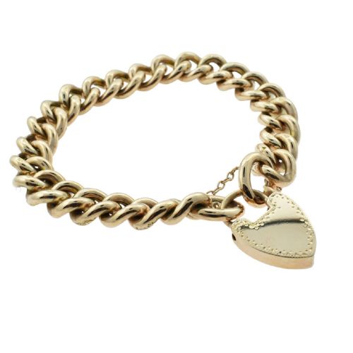 fig 1. An antique 9ct rose gold curb chain bracelet featuring alternating hand-engraved links, a heart-shaped padlock clasp, and a safety chain.