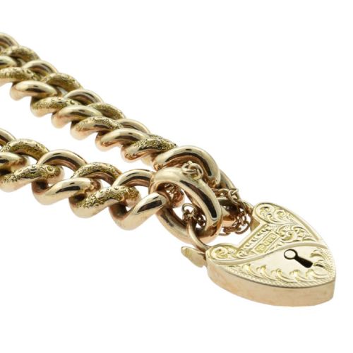 An antique 9ct rose gold curb chain bracelet featuring alternating hand-engraved links, a heart-shaped padlock clasp, and a safety chain. View IV