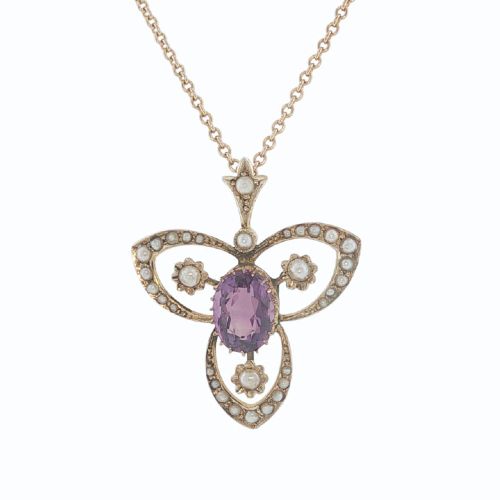 fig 1. An Edwardian 9ct gold openwork pendant featuring a central oval amethyst surrounded by delicate seed pearls on a fine chain.