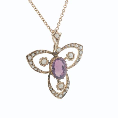 fig 2. An Edwardian 9ct gold openwork pendant featuring a central oval amethyst surrounded by delicate seed pearls on a fine chain.