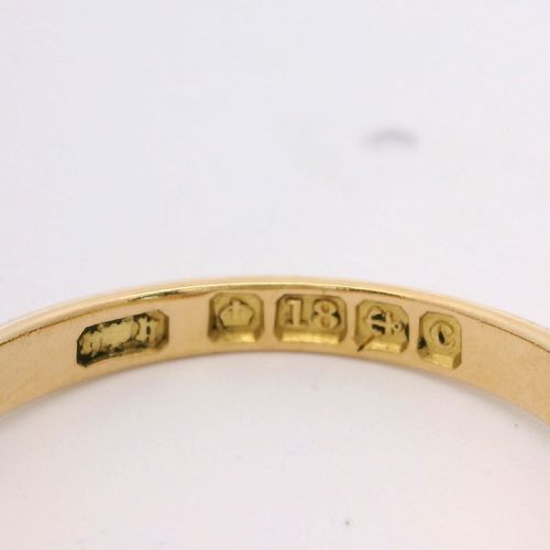 An 18ct yellow gold Edwardian boat ring set with three oval cabochon opals and small diamond accents within a carved gallery. View III
