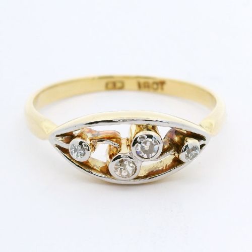 An 18ct yellow gold band with an elongated openwork navette head holding four round bezel-set diamonds.