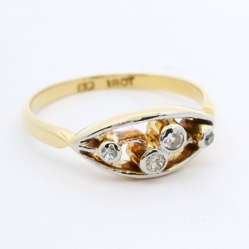 An 18ct yellow gold band with an elongated openwork navette head holding four round bezel-set diamonds. View III
