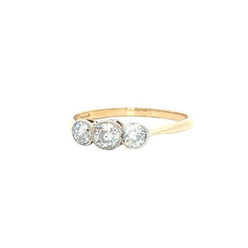 fig 1. An antique 18ct yellow gold ring set with three round old-cut diamonds in a horizontal trilogy setting.