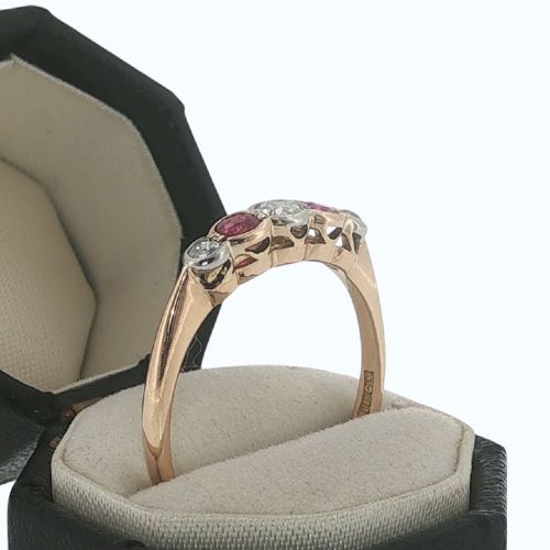 fig 2. An antique 18ct yellow gold ring featuring a five-stone setting with alternating rubies and diamonds.