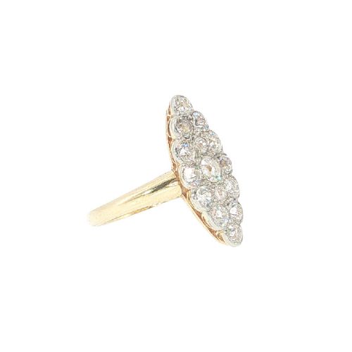 fig 2. An Edwardian navette cluster ring featuring multiple old cut diamonds set in platinum with an 18ct yellow gold band.