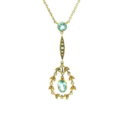 fig 1. An Edwardian 15ct gold lavalier necklace featuring a round aquamarine top stone, a seed-pearl-set vertical bar, and a floral garland pendant surrounding a suspended oval aquamarine.