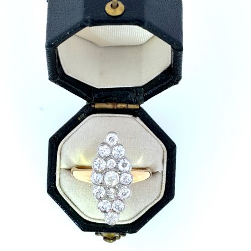 fig 1. An Edwardian navette cluster ring featuring multiple old cut diamonds set in platinum with an 18ct yellow gold band.
