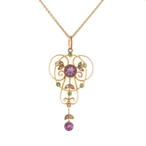 fig 1. An openwork 9ct gold Edwardian pendant set with round amethysts, peridots, and seed pearls suspended on a fine chain.