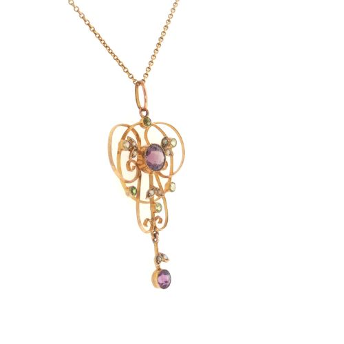 fig 3. An openwork 9ct gold Edwardian pendant set with round amethysts, peridots, and seed pearls suspended on a fine chain.