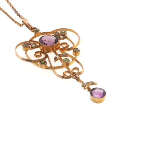 fig 4. An openwork 9ct gold Edwardian pendant set with round amethysts, peridots, and seed pearls suspended on a fine chain.