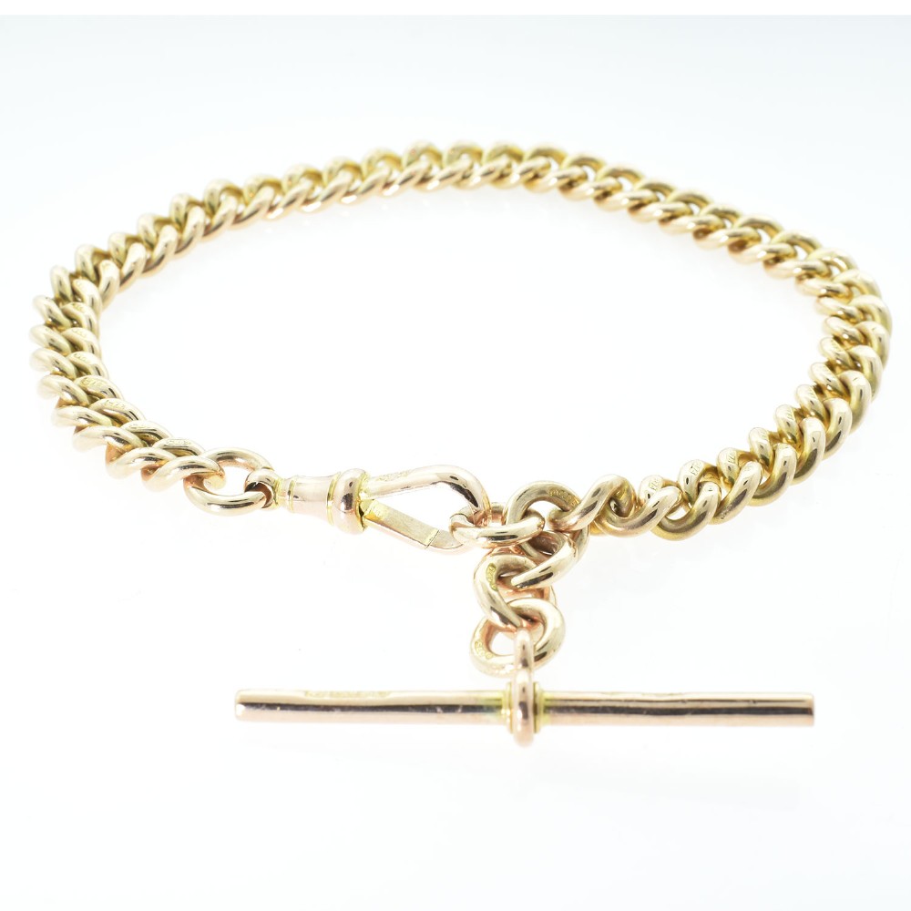 An antique 9ct rose gold Albert chain bracelet featuring uniform curb links, a suspended T-bar pendant, and a swivel clasp. View III