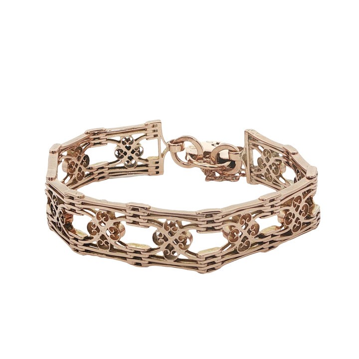 An antique 9ct rose gold gate link bracelet featuring decorative openwork filigree panels and a heart-shaped padlock clasp. View II