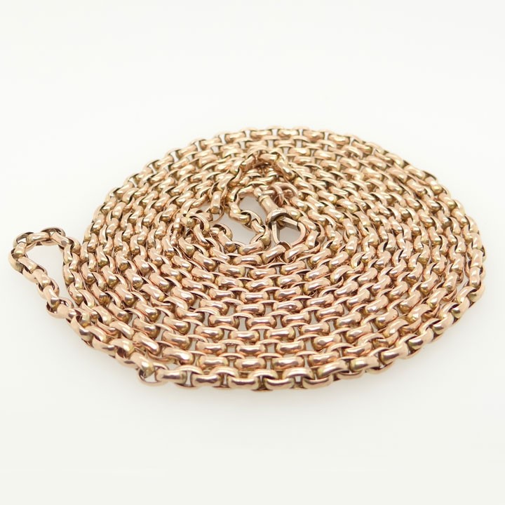 An antique 9ct rose gold long guard chain composed of uniform belcher links folded into multiple strands. View III