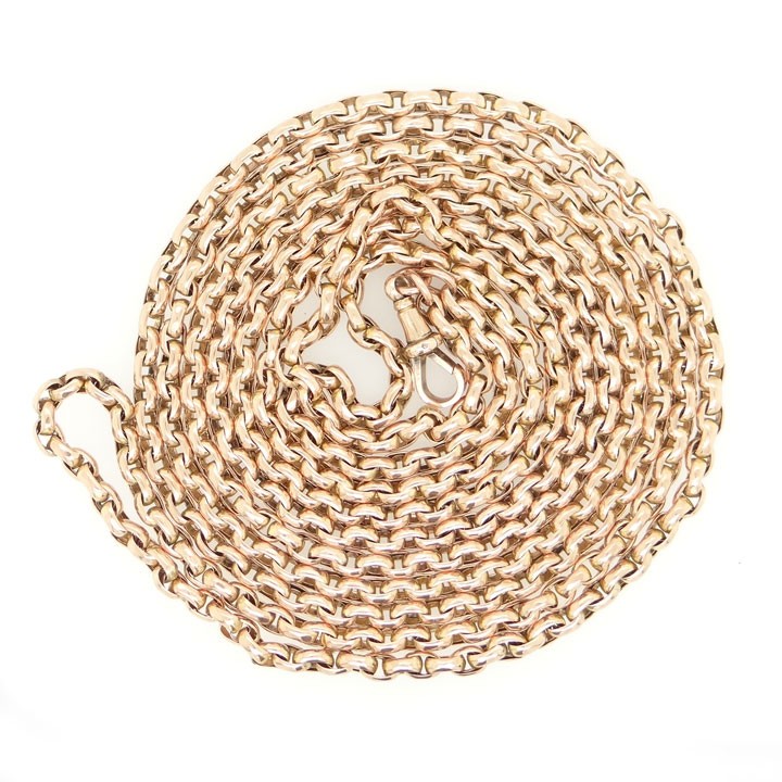 An antique 9ct rose gold long guard chain composed of uniform belcher links folded into multiple strands. View IV