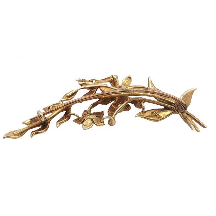 An antique 15ct yellow gold floral spray brooch featuring articulated flowers and leaves set with seed pearls, attached to a safety chain. View VI