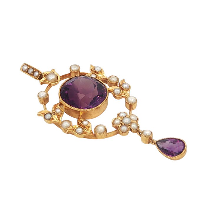 An openwork 15ct yellow gold oval pendant featuring a central round faceted amethyst framed by seed pearl leaf motifs, with a pear-cut amethyst drop suspended below. View III