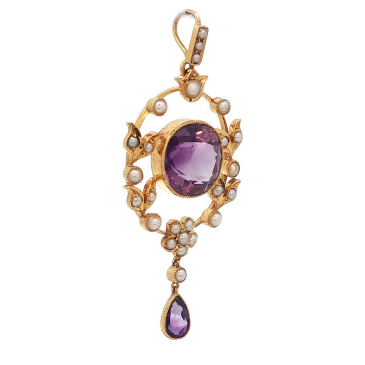 An openwork 15ct yellow gold oval pendant featuring a central round faceted amethyst framed by seed pearl leaf motifs, with a pear-cut amethyst drop suspended below. View V