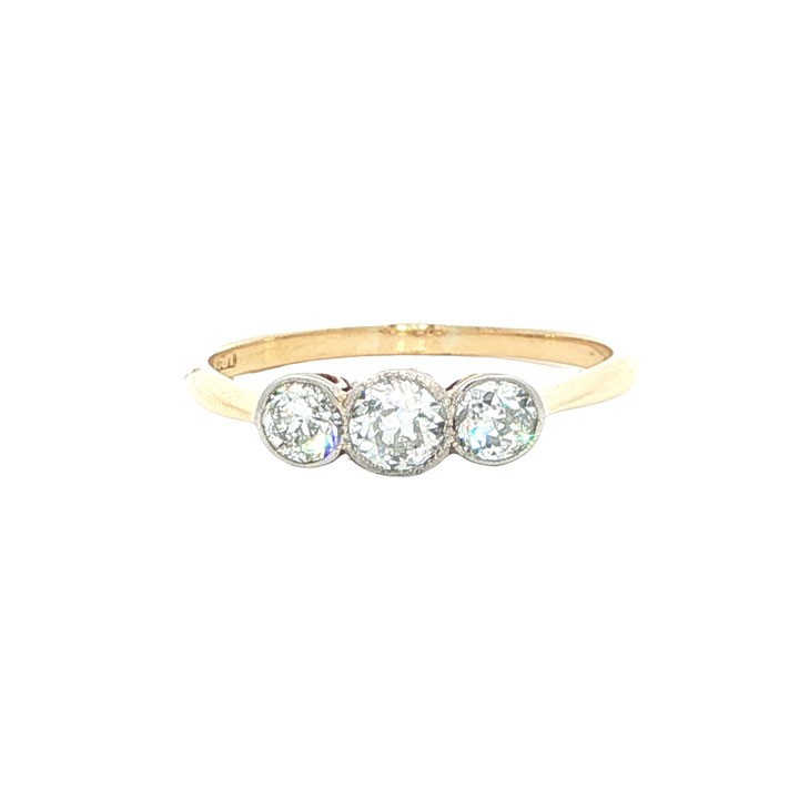An antique 18ct yellow gold ring set with three round old-cut diamonds in a horizontal trilogy setting.