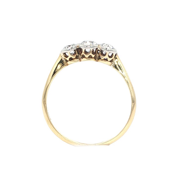 An antique 18ct yellow gold ring set with three round old-cut diamonds in a horizontal trilogy setting. View IV